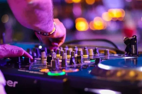 DJ mixing music on professional equipment
